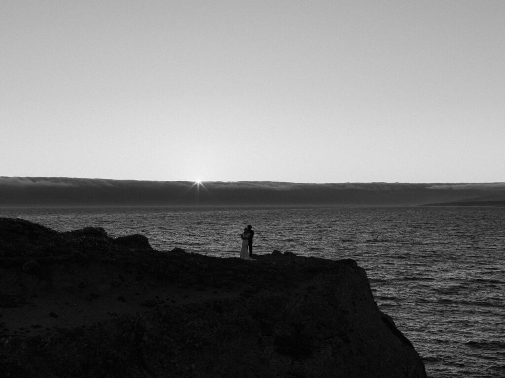 Showing up fully as yourself for photoshoots can look like many different things.  For example, this photograph from a distance of a couple on the California coast at sunset