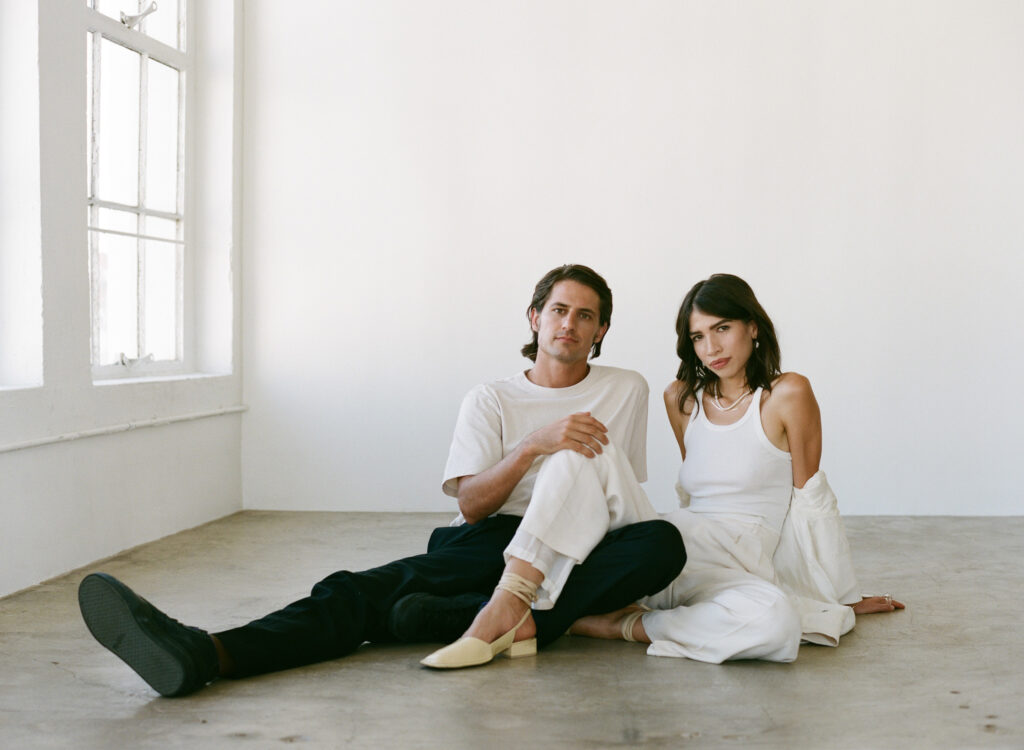 The epitome of showing up fully as yourself for photoshoots  - A portrait of a millennial engaged couple in a Downtown Los Angeles Photo Studio