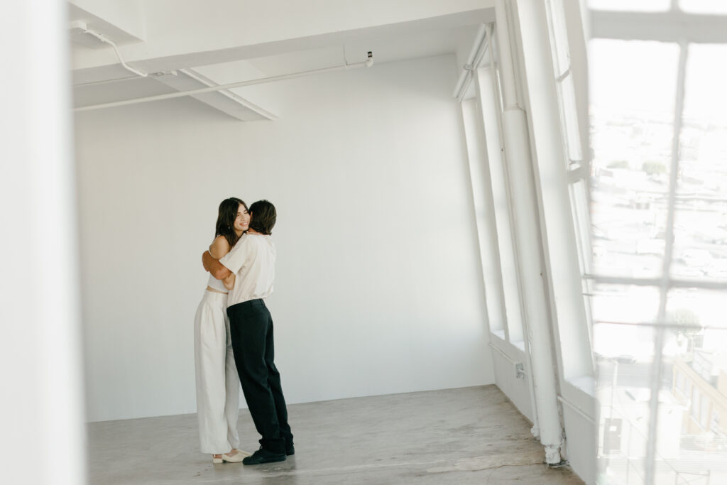 Styling your engagement session with a Stylish Couple in Monochromatic Outfits in a Photography Studio