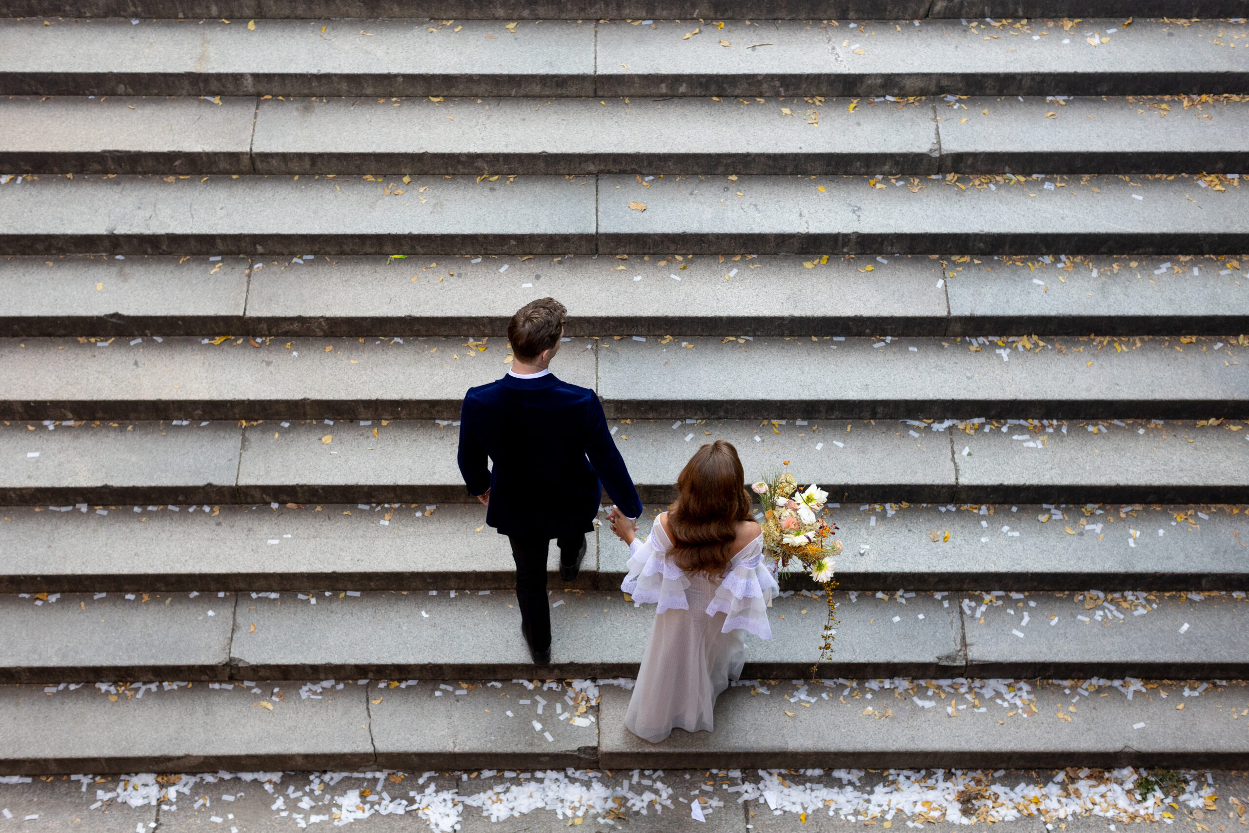 A wedding couple on the steps at Central Park, New York City